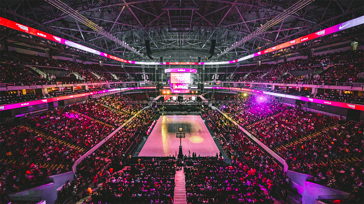 indoor basketball arena full crowd game action